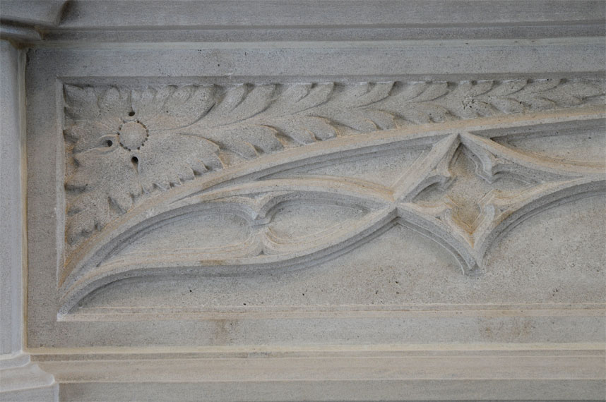 flower detail on fireplace mantel