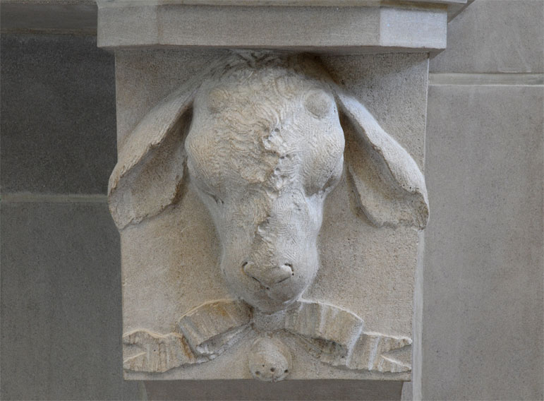 lamb sculpted on fireplace mantel