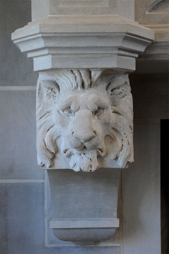lion head on Gothic fireplace mantel