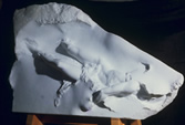 marble sculpture of figure submerged
