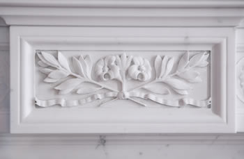 lillies carved in fireplace mantel