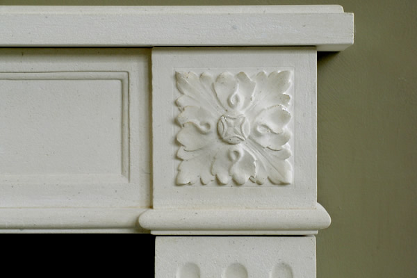 rosette detail on fireplace mantel